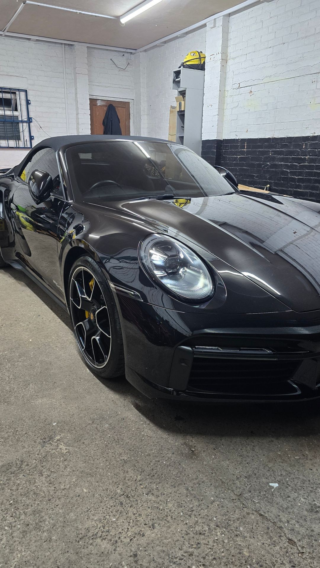 Black porsche 911 being detailed at MJ's Detailing Birmingham Black porsche 911 being detailed at MJ's Detailing Birmingham